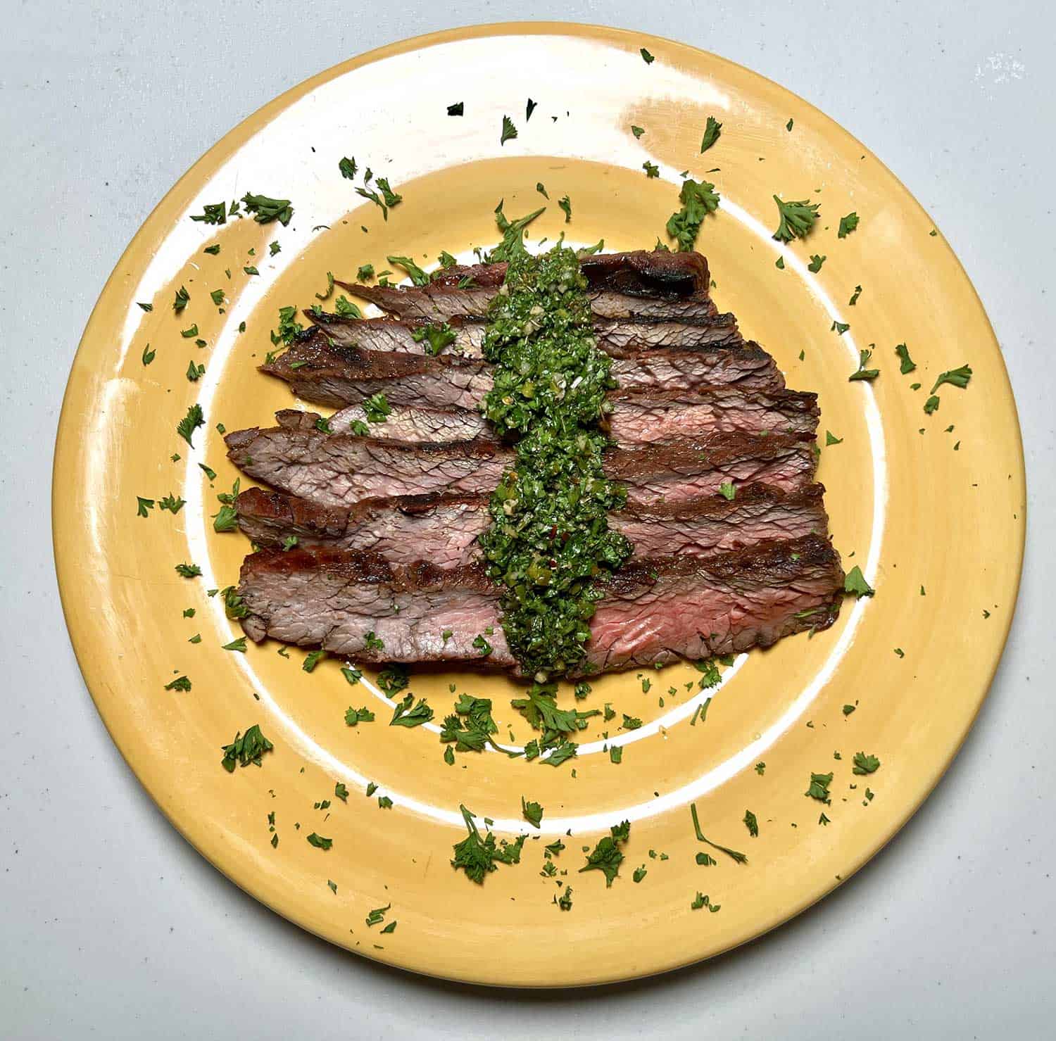 Grilled steak with chimichurri sauce