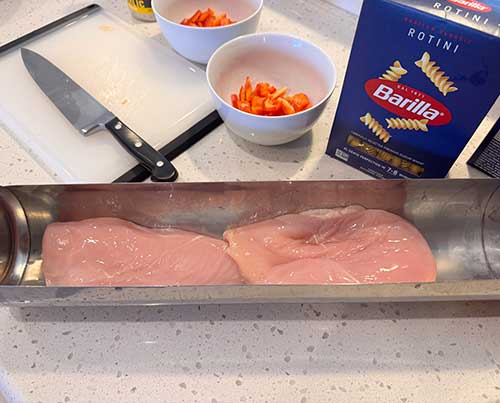 Add chicken breast to cooking tray