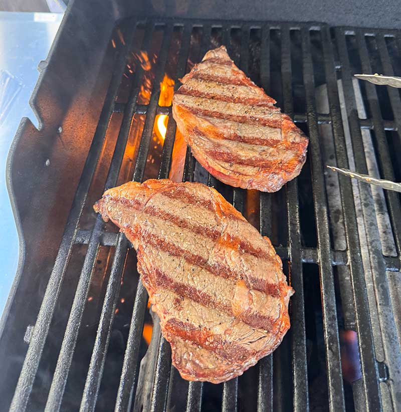 Searing ribeye steak