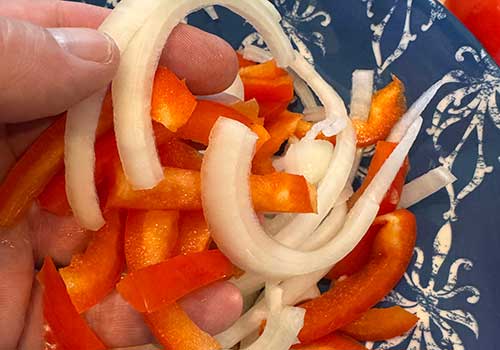 Slice peppers and onions
