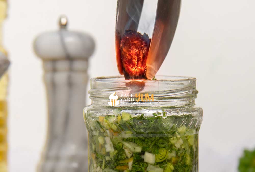 Give your chimichurri sauce a smoky flavor by adding a hot coal for a few minutes