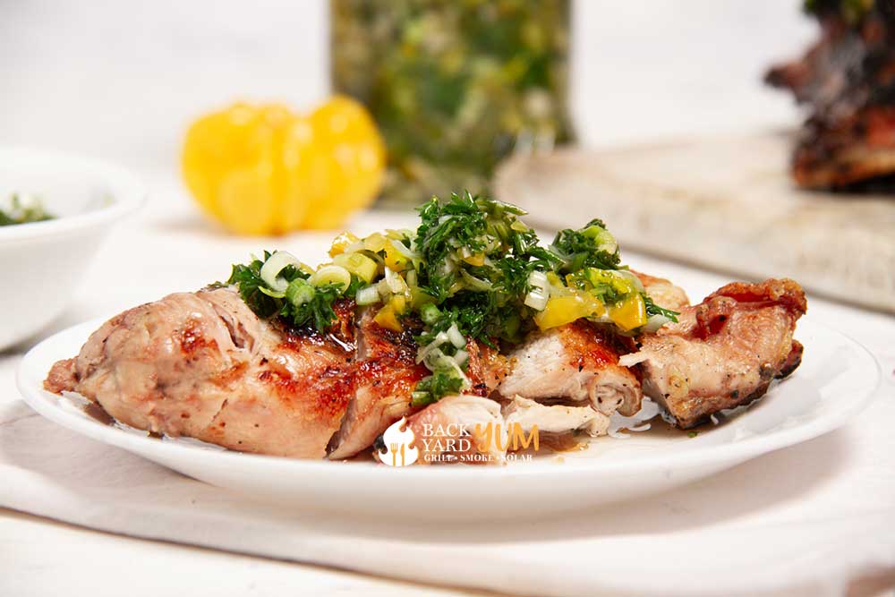 Grilled chicken with chimichurri on a plate