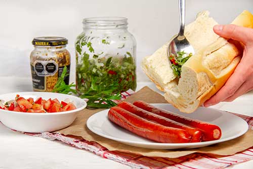 Assemble the choripan sandwiches