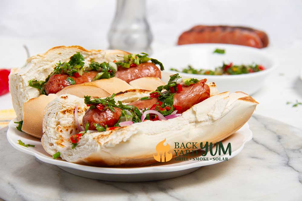 Grilled choripan served in a baguette bun