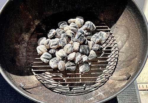 Pour the hot coals on the grill
