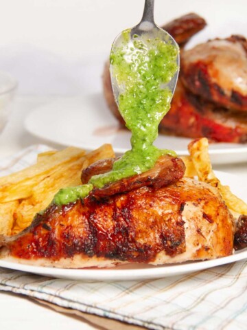 Peruvian Chicken with green sauce on a plate