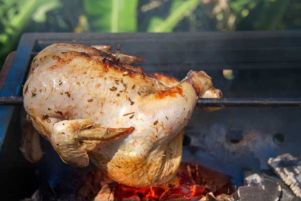 Cook the chicken over medium-hot coals, turning often